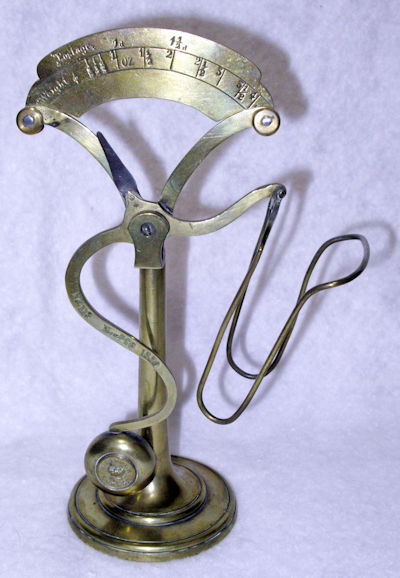 letter scale No. 113 in shiny brass
