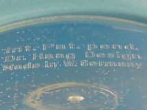 text in bottom outer cylinder